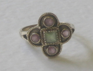 A 9ct gold dress ring set a central peridot and 4 amethysts