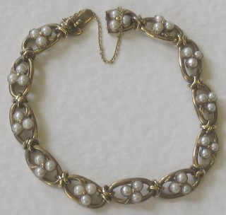 A yellow gold bracelet set pearls