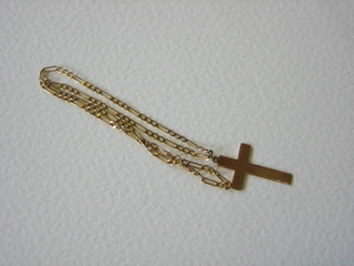 A 9ct gold cross hung a flat link chain