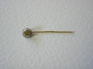 A stick pin set diamonds
