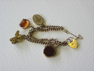 A 9ct gold charm bracelet hung 2 seals and 2 charms