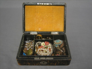 A Victorian leather covered jewellery box containing a collection of costume jewellery