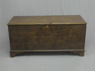 An 18th/19th Century elm coffer with hinged lid