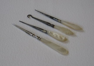 A button hook with mother of pearl handle and 3 bodkins