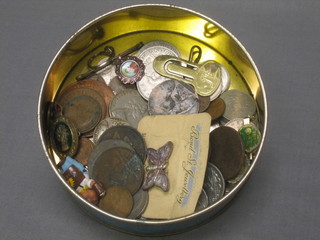A small collection of various coins and badges