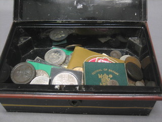 A metal cash box containing a collection of various coins including crowns, 1 George III penny, other pennies etc