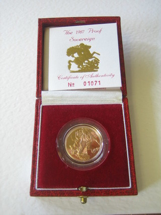 A 1987 gold proof sovereign, cased