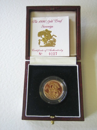 A 1990 gold proof sovereign, cased