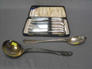 6 tea knives with silver plated pistol grip handle, together with a silver plated ladle and a serving spoon