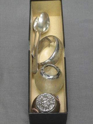 A silver bangle, 2 silver spoons and a pottery jar with silver lid and a glass match striker