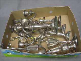 A modern silver plated 3 light candelabrum, a pair of silver plated trumpet shaped specimen vases, a pair of plated goblets and a collection of silver plated figures depicting Tradesmen