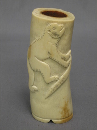 A carved section of ivory decorated a monkey 6"