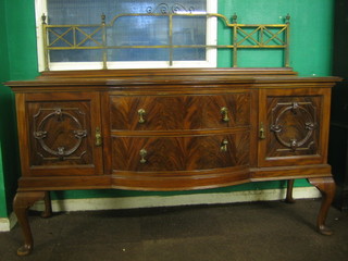 An Edwardian Chippendale style mahogany bow front sideboard with brass railed back, fitted 2 bow drawers flanked by a pair of cupboards, raised on cabriole supports 72"