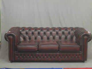 An excellent quality modern mahogany framed 3 seat Chesterfield upholstered in red buttoned back leather (as new) 75"