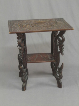 A rectangular Eastern carved hardwood 2 tier occasional table raised on pierced supports 23"