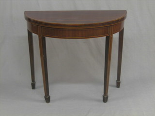 An Edwardian Georgian style inlaid mahogany demi-lune card table, raised on square tapering supports ending in spade feet 36"