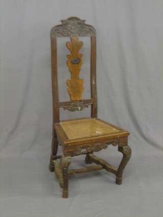 An 18th Century French walnut high back hall chair with vase shaped slat back and woven cane seat, raised on cabriole supports