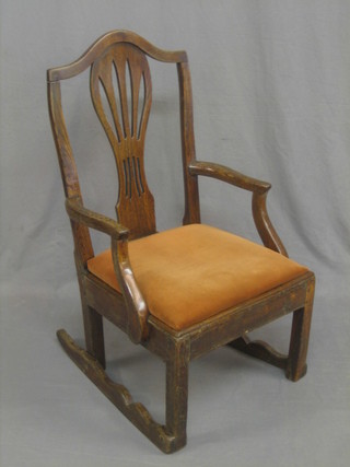 An 18th Century oak Hepplewhite style rocking carver chair