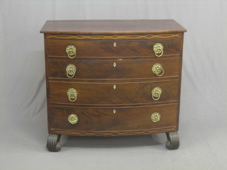 A Georgian inlaid mahogany bow front chest of 4 long drawers with ivory escutcheons and brass drop handles, raised on scrolled feet 43"