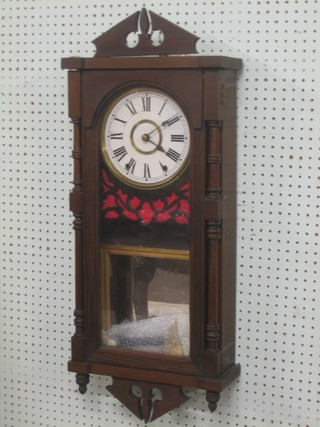 A 19th Century striking wall clock with paper dial and Roman numerals, contained in a mahogany finished case 31"