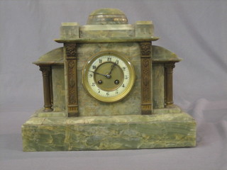A Victorian French 8 day striking mantel clock contained in a green onyx architectural case