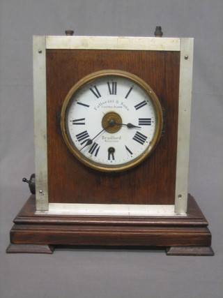 An electric mantel clock with enamelled dial and Roman numerals by Fattorini & Sons
