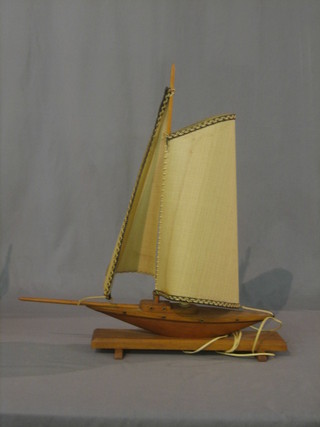 An Art Deco teak table lamp in the form of a yacht  16"