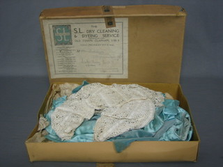 A Page Boys powder blue suit comprising silk breeches, jacket and cape together with a crocheted dress