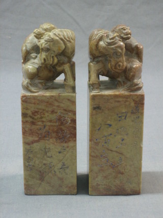 A pair of Eastern carved "marble" seals decorated rearing horses 6"