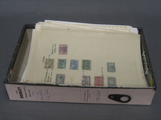 A cardboard filing box containing various stamp pages etc