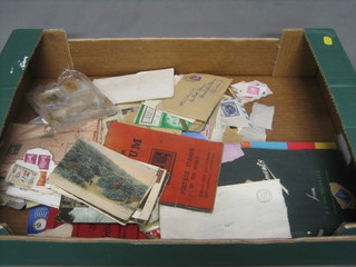 An album of various stamps and a box containing loose stamps etc