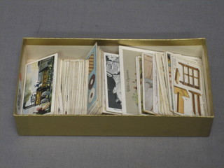 A small collection of various cigarette cards