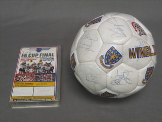 A signed Wimbledon F C football marked FA Cup Winners 1988 together a limited edition FA Cup Final video Nottingham Forrest V Tottenham Hotspur 1991