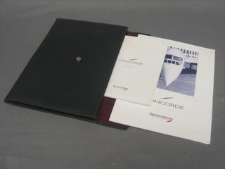  A Concorde leather finished folder containing a brochure, a Concorde note book and Concorde note paper