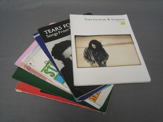 An Annie theatre programme, a collection of Tears for Fears sheet music and a Rod Stewart book