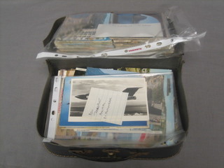 A small attache case containing various postcards