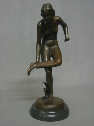 A reproduction antique style bronze figure in the form of a standing naked lady 14"