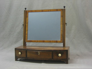 A Georgian rectangular plate dressing table mirror contained in a mahogany swing frame, the bow front base fitted 1 long drawer flanked by 2 short drawers 18"