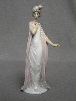 A Lladro figure in the form of a standing lady, the base marked 6403 F17F 11"