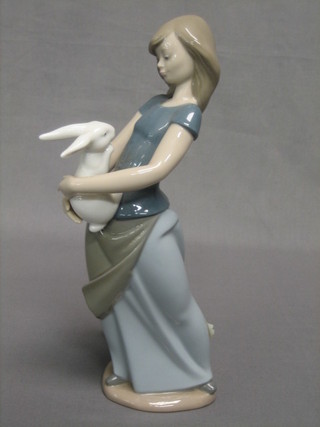A Nao figure of a standing lady with rabbit 10"