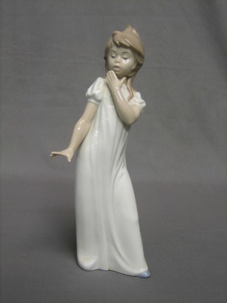 A Nao figure of a standing girl in a night gown 11"