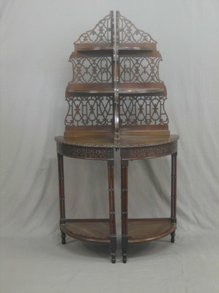 A pair of Edwardian Chippendale style mahogany 4 tier corner whatnots with pierced backs, raised on turned column supports