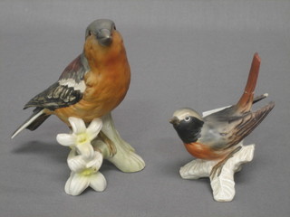 A Goebel figure of a Red Star (tail f) and a other Goebel figure of a bird (2)