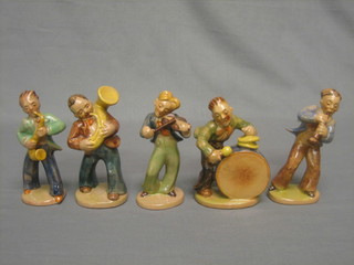 A 1940's Continental terracotta 5 piece jazz band comprising saxophonist, fiddler (f), drummer and 2 others (1f)