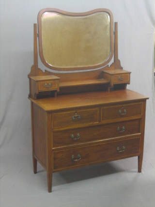 An Edwardian inlaid mahogany dressing chest with mirror, fitted 2 glove drawers above 2 short and 2 long drawers, raised on square supports 42"