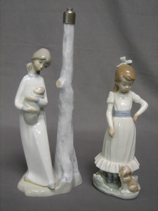 A Nao figure of a standing girl 8"  together with a Nao lamp base in the form of a standing mother and child 4"