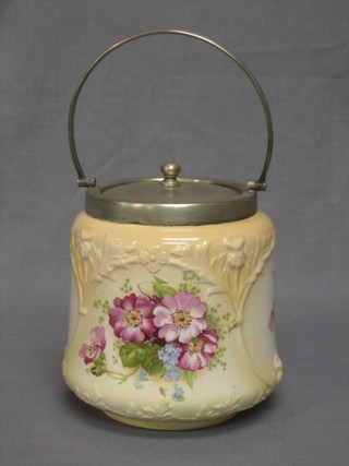 A pottery biscuit barrel with silver plated mounts