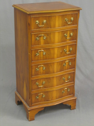 A Georgian style yew chest of serpentine outline fitted 6 long drawers, raised on bracket feet 19"