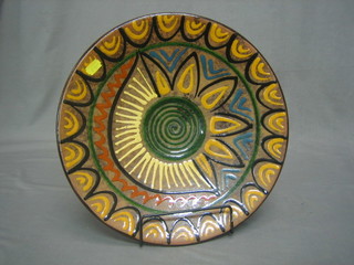 A 1920's circular French terracotta charger 14"