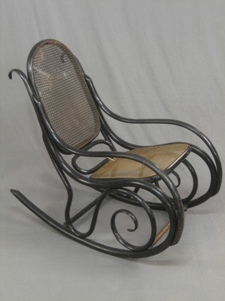 An ebonised Thonet style bentwood rocking chair